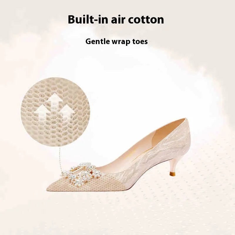 Champagne gold pointed-toe stiletto high heels with rhinestone decoration.