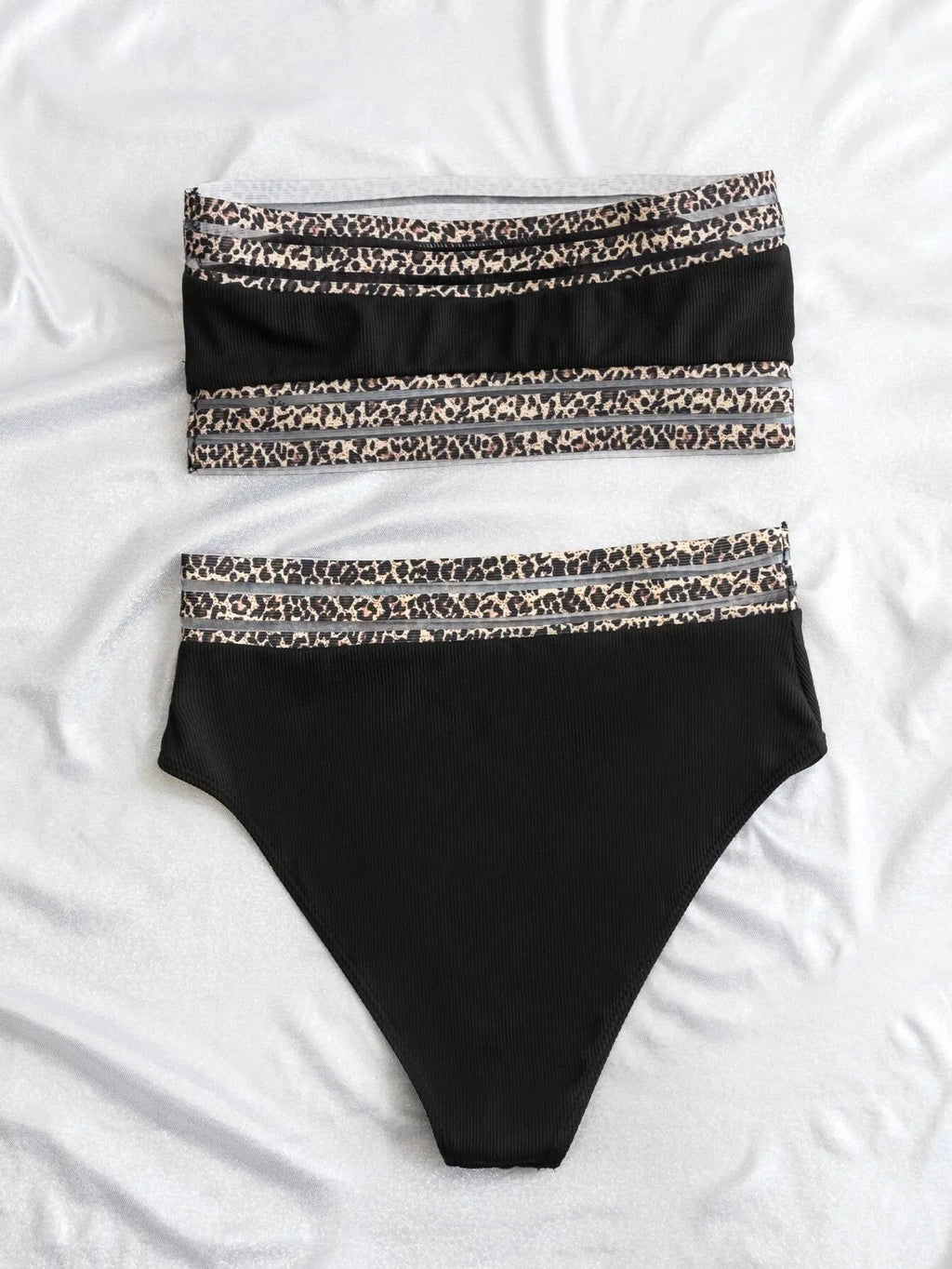 Black strapless leopard print bikini set with separate bra and shorts on a neutral background.