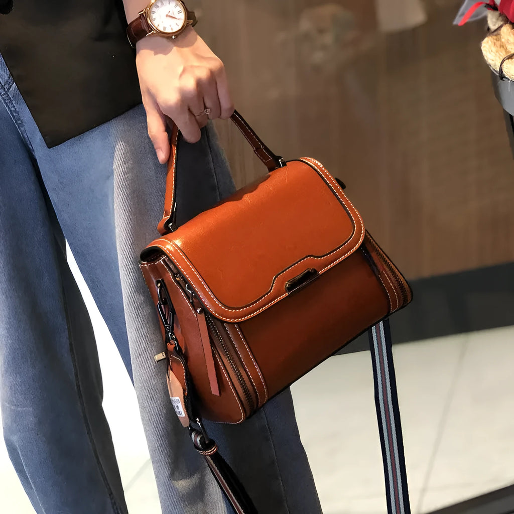Women's genuine leather messenger bag in horizontal square design with multiple internal compartments