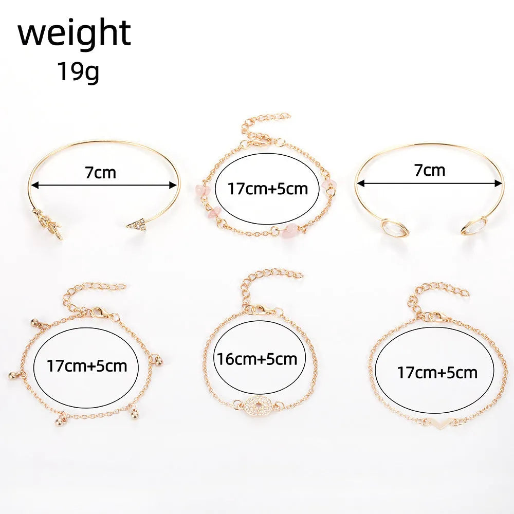 Gold-coloured women's bracelet set with six charms: arrow, water drop, and V shapes.
