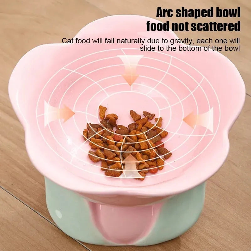 Blue ceramic elevated pet feeding bowl with floral pattern and non-slip base