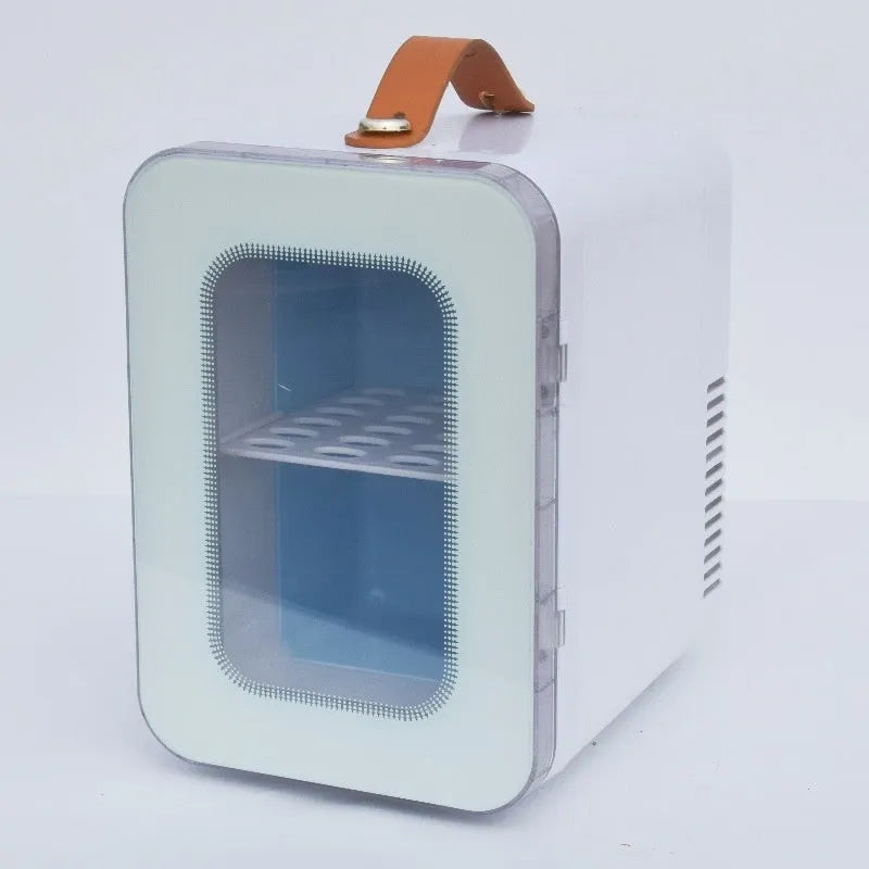 Pink mini refrigerator with transparent door showing interior storage for cosmetics