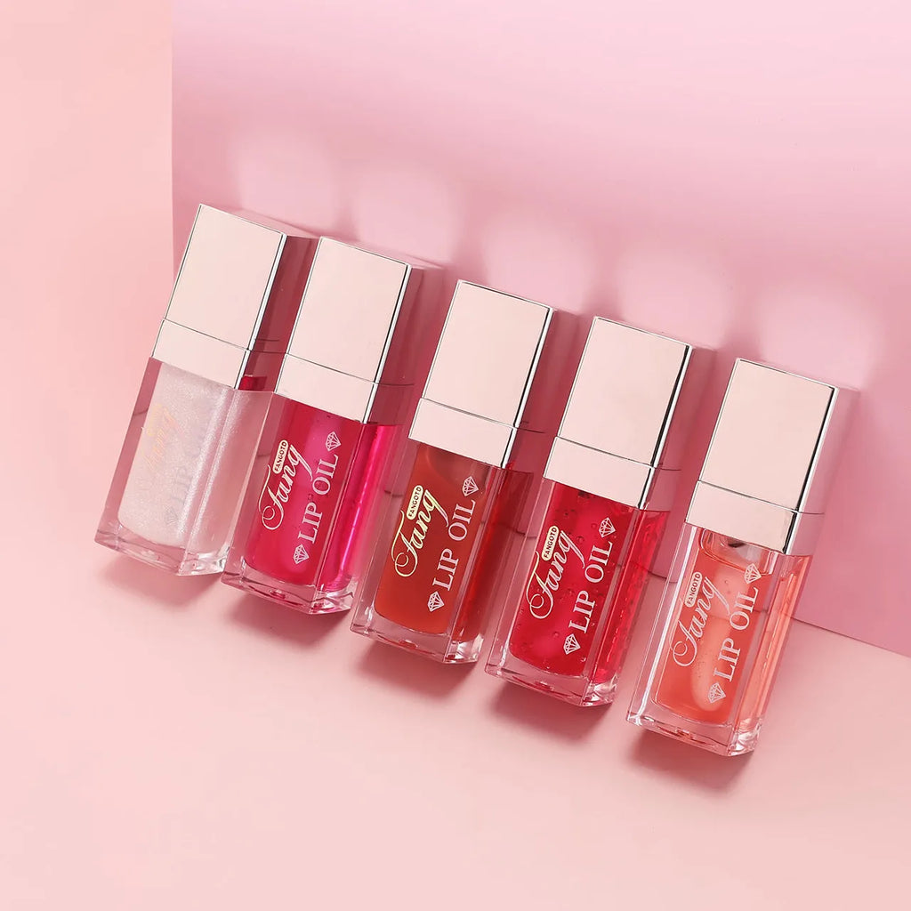 Mint lip gloss tube in one of five colours including bright pink, orange and dark red.