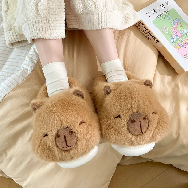 Light brown women's winter plush slippers with a cartoon pattern, round toe, and a pull-on oversleeve design.