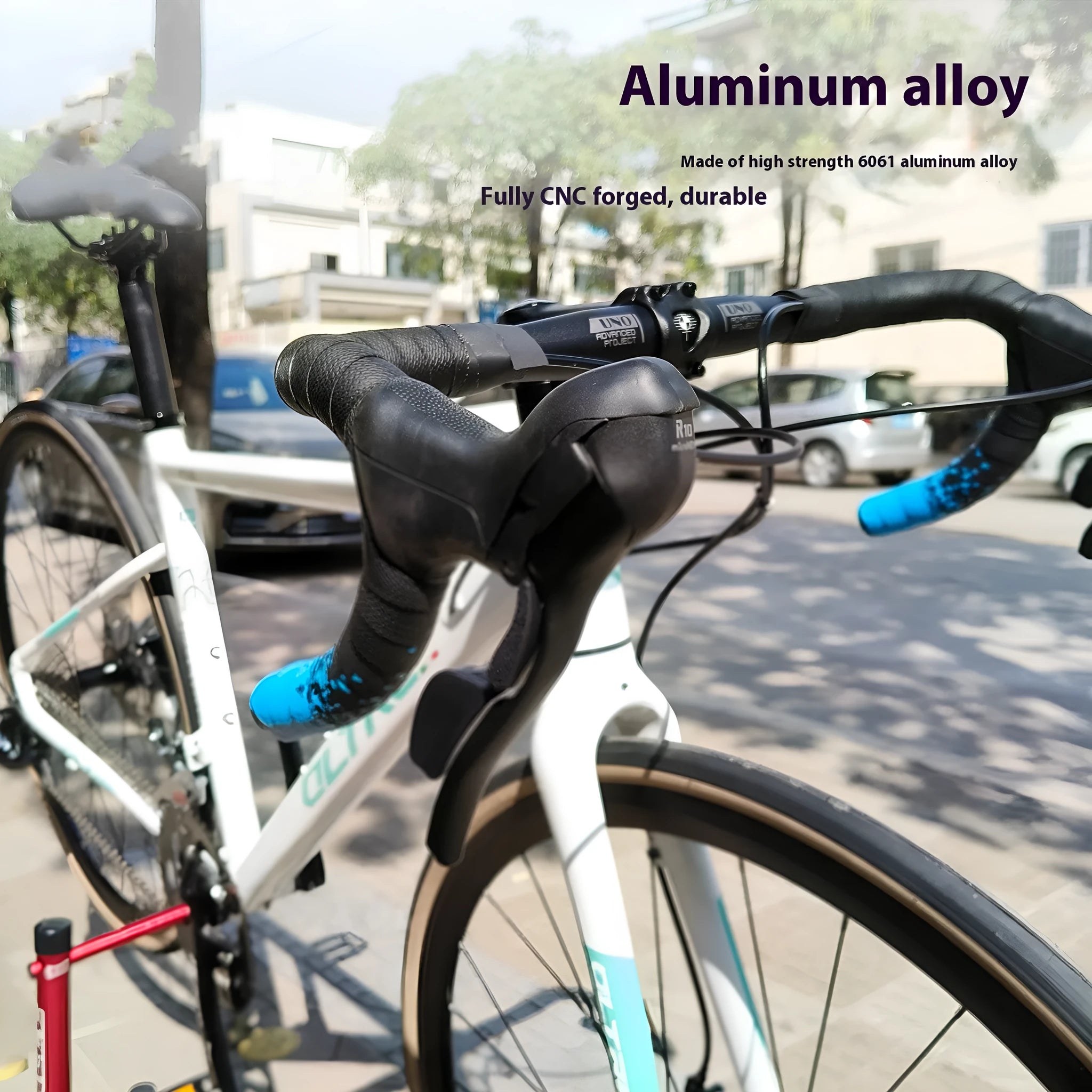 Black UNO aluminium alloy road bike racing handlebar with a bent shape and printed markings.
