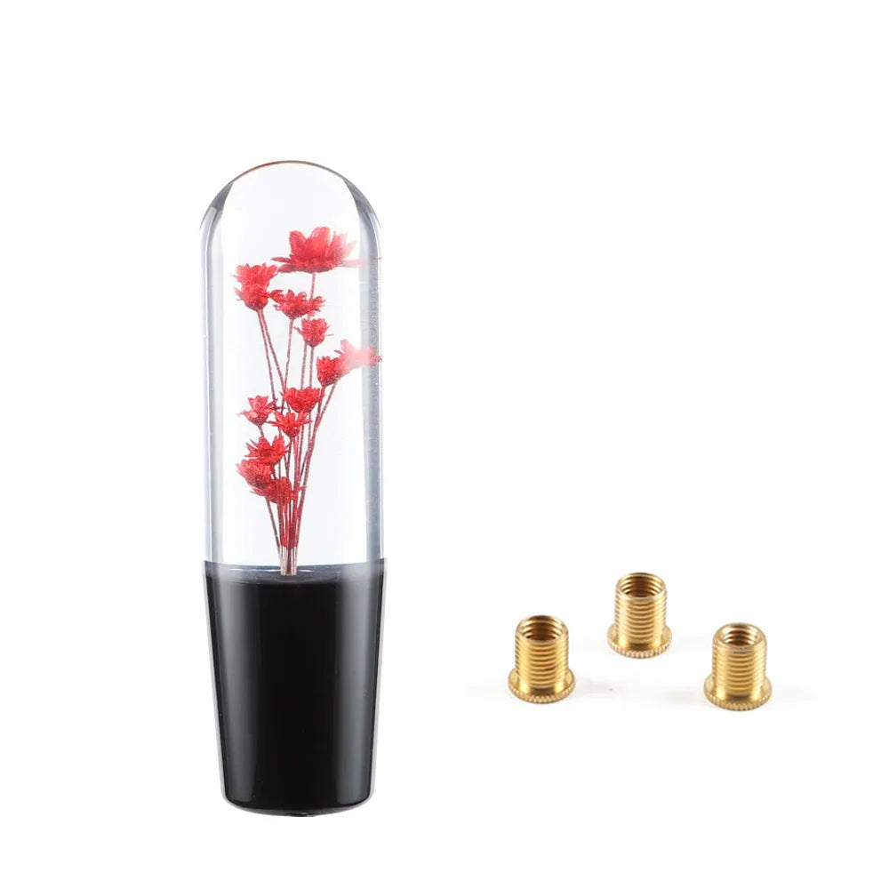 JDM crystal car gear knob with flower-in-water design, 15cm long, shown with three fitting adapters