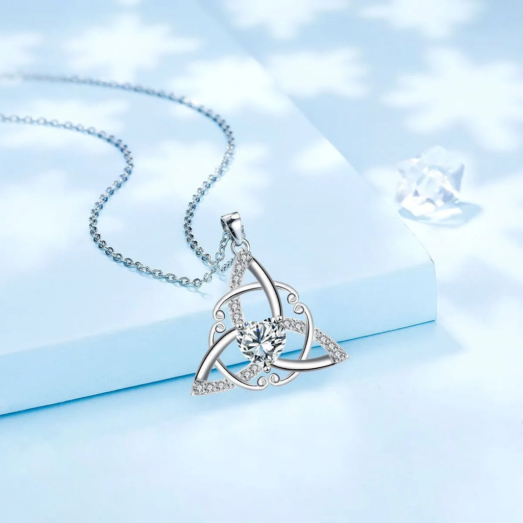 Women's geometric Celtic knot pendant necklace in electroplated copper, showing blue colour option.