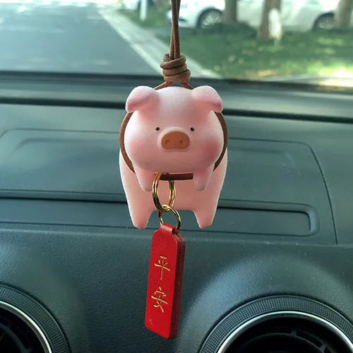 Cartoon pig character resin car ornament for dashboard or windscreen decoration.