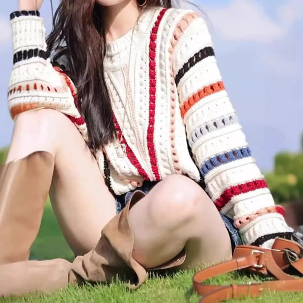 Rainbow striped hollow knit sweater with batwing sleeves and round neck