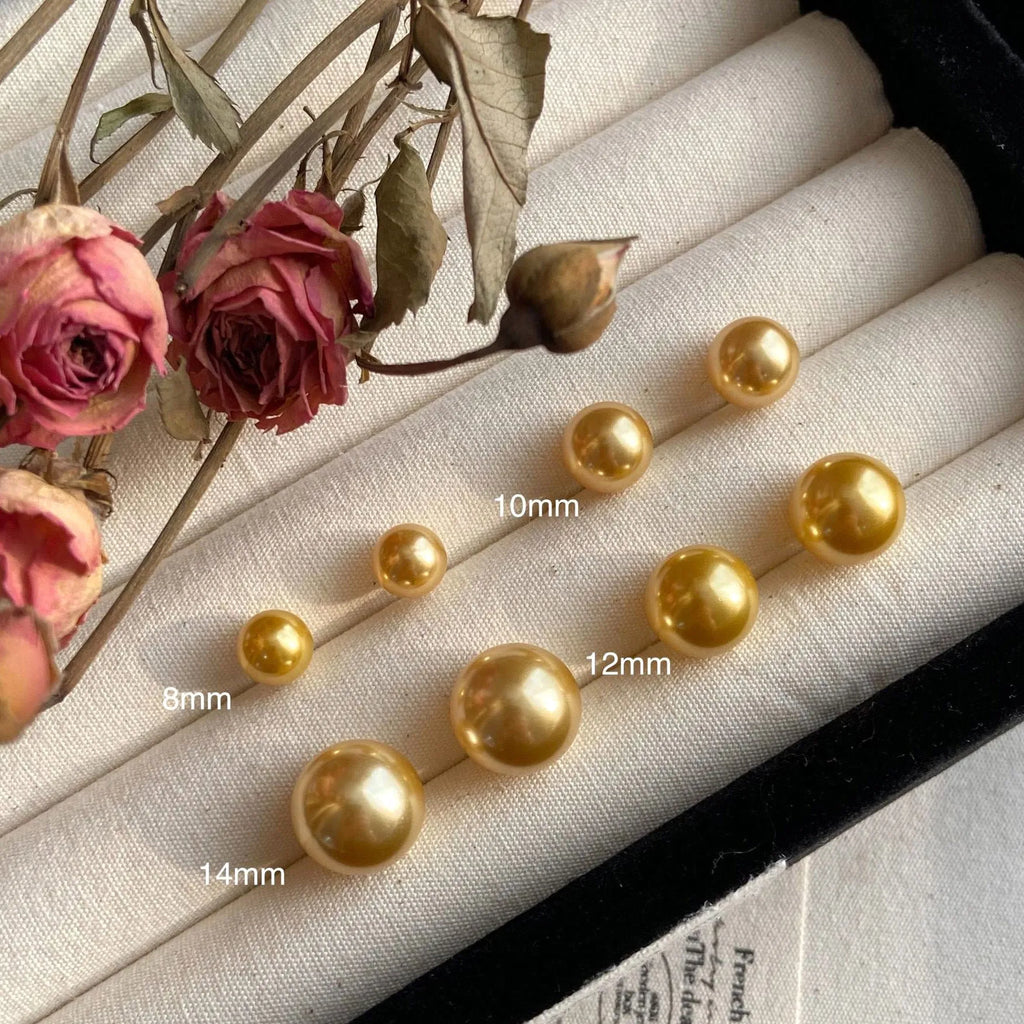 Large geometric pearl stud earrings for women with an eight-point star detail, shown in silver.