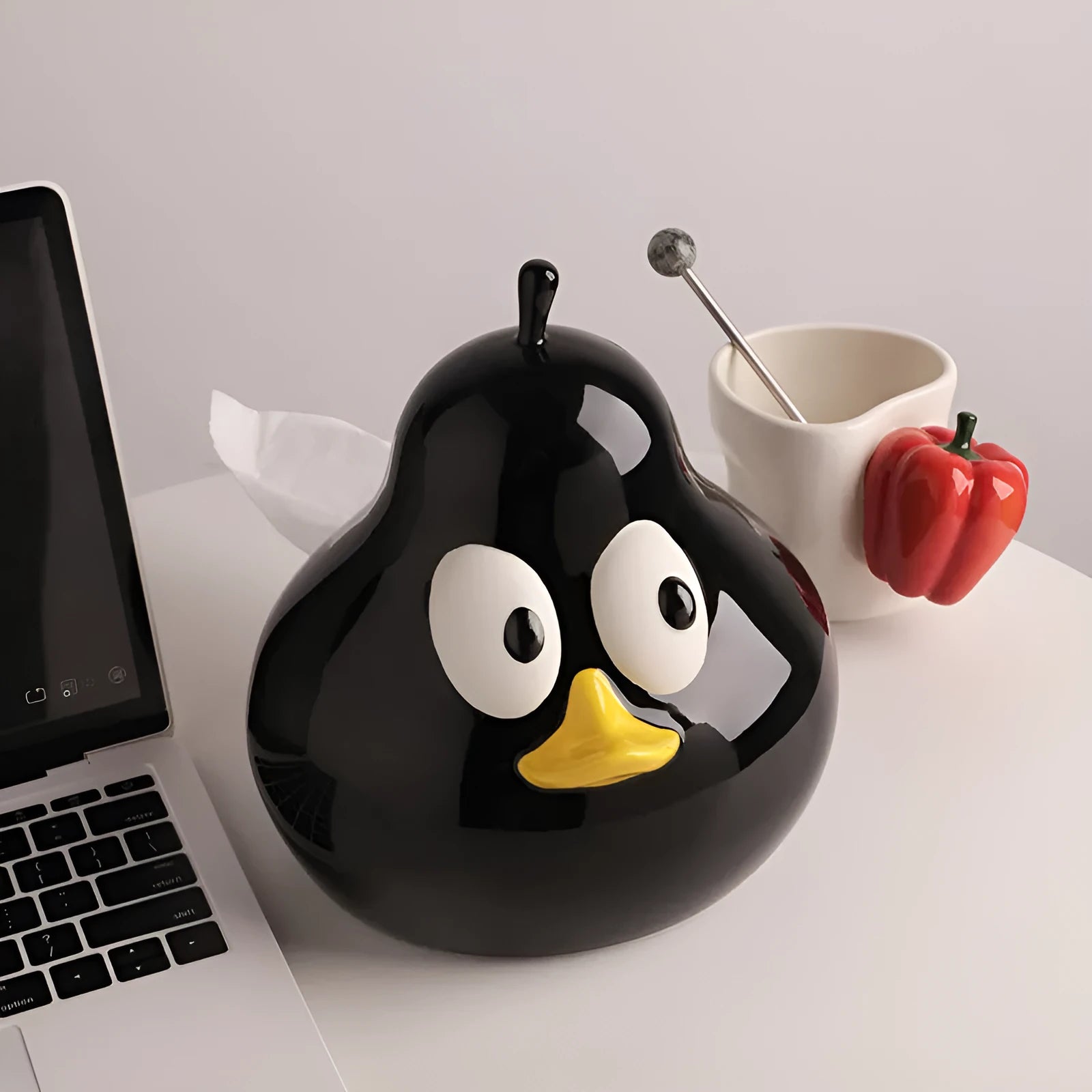 White ceramic pear-shaped tissue box with animal-themed design in green colour option