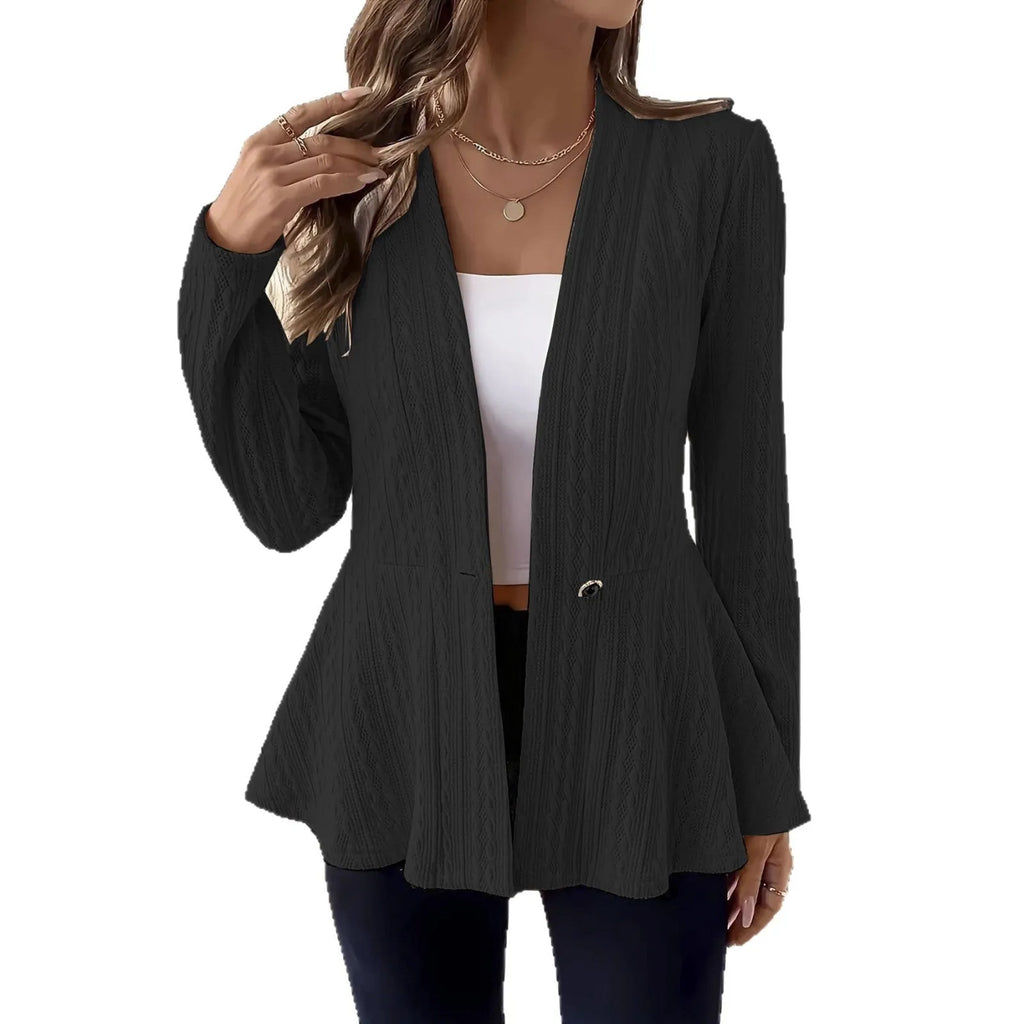 Women's apricot coloured Jacquard patterned knitted cardigan with one button, shown on a model.