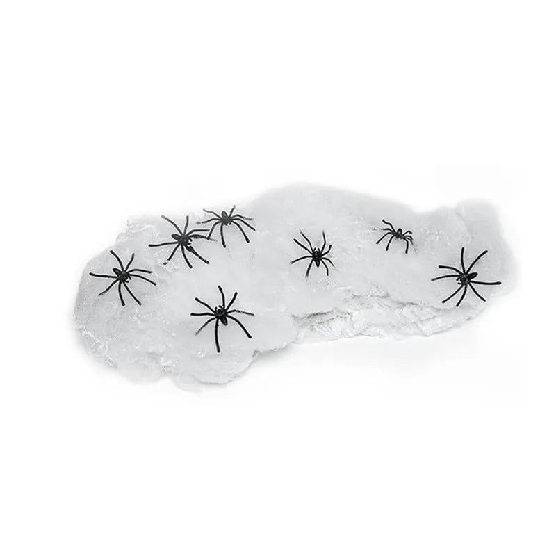 White cotton spider web Halloween decoration with plastic spiders for parties and home displays
