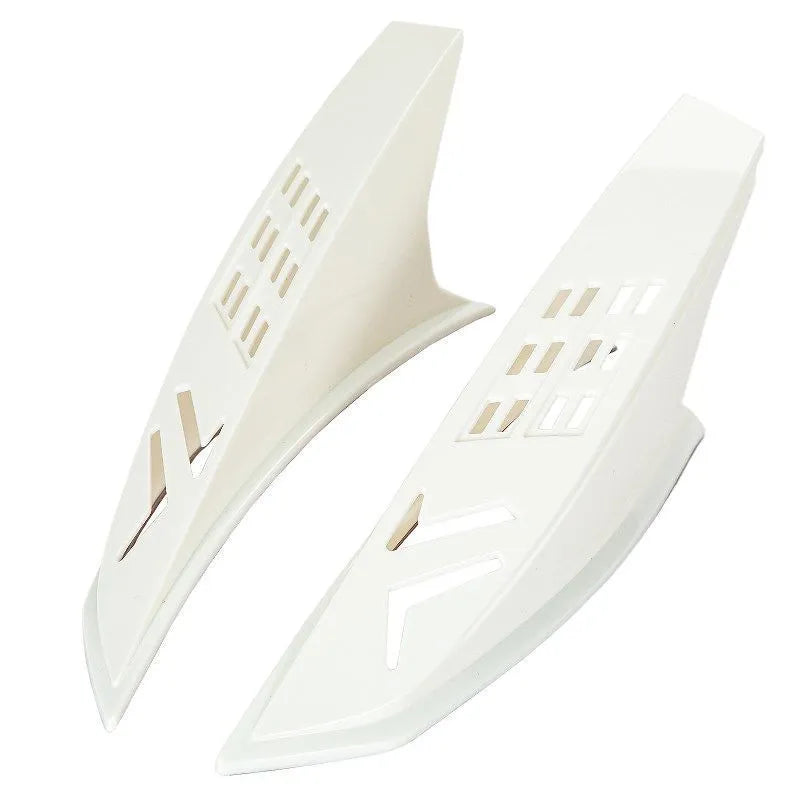 A pair of coloured helmet horns for child's motorcycle or ski helmet modification.