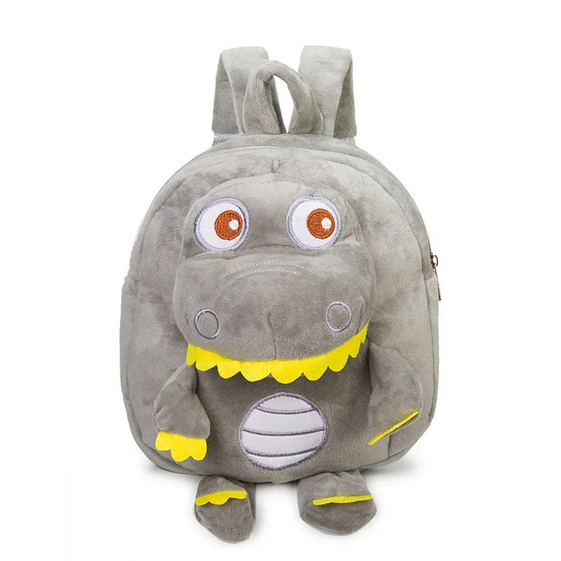 Soft blue dinosaur plush backpack for children with embroidered details and a soft handle.