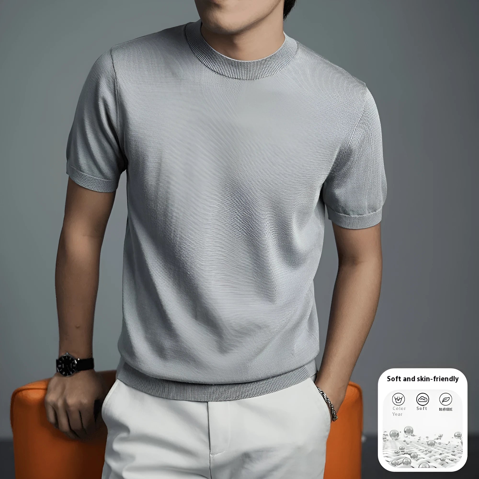 Man wearing a solid colour knitted business t-shirt with round neck and short sleeves.