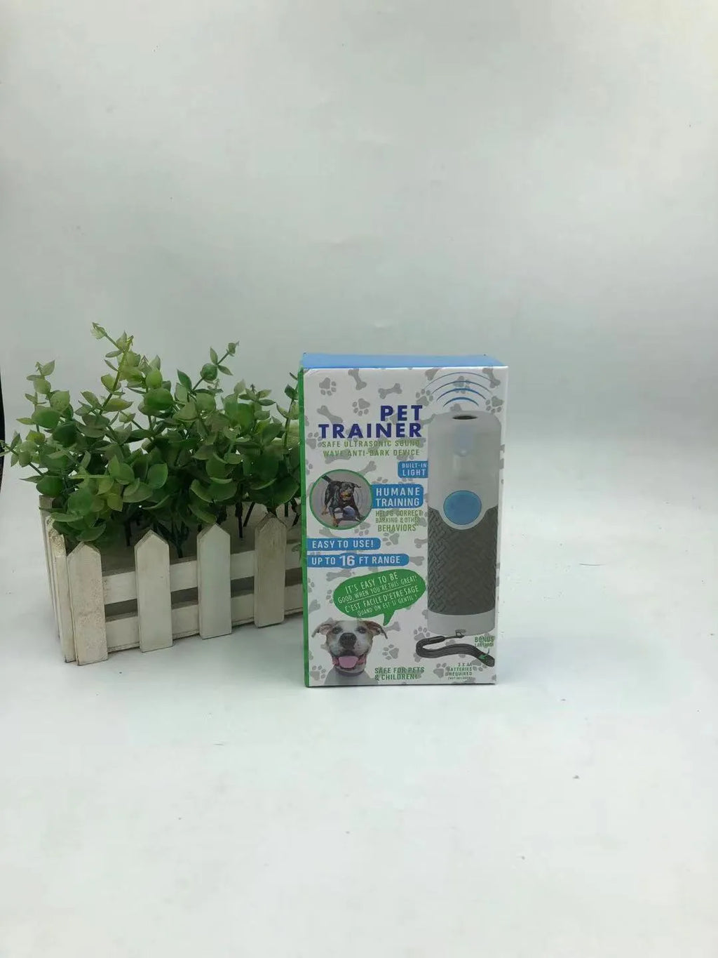 White handheld ultrasonic dog bark trainer with ABS plastic housing