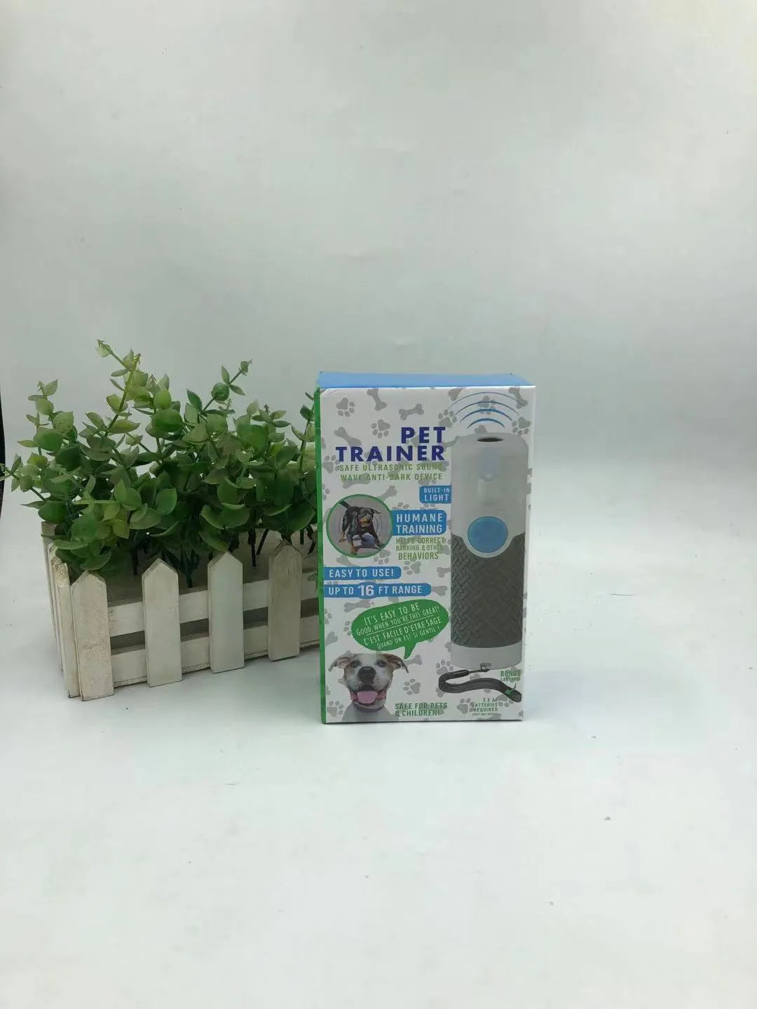 White handheld ultrasonic dog bark trainer with ABS plastic housing