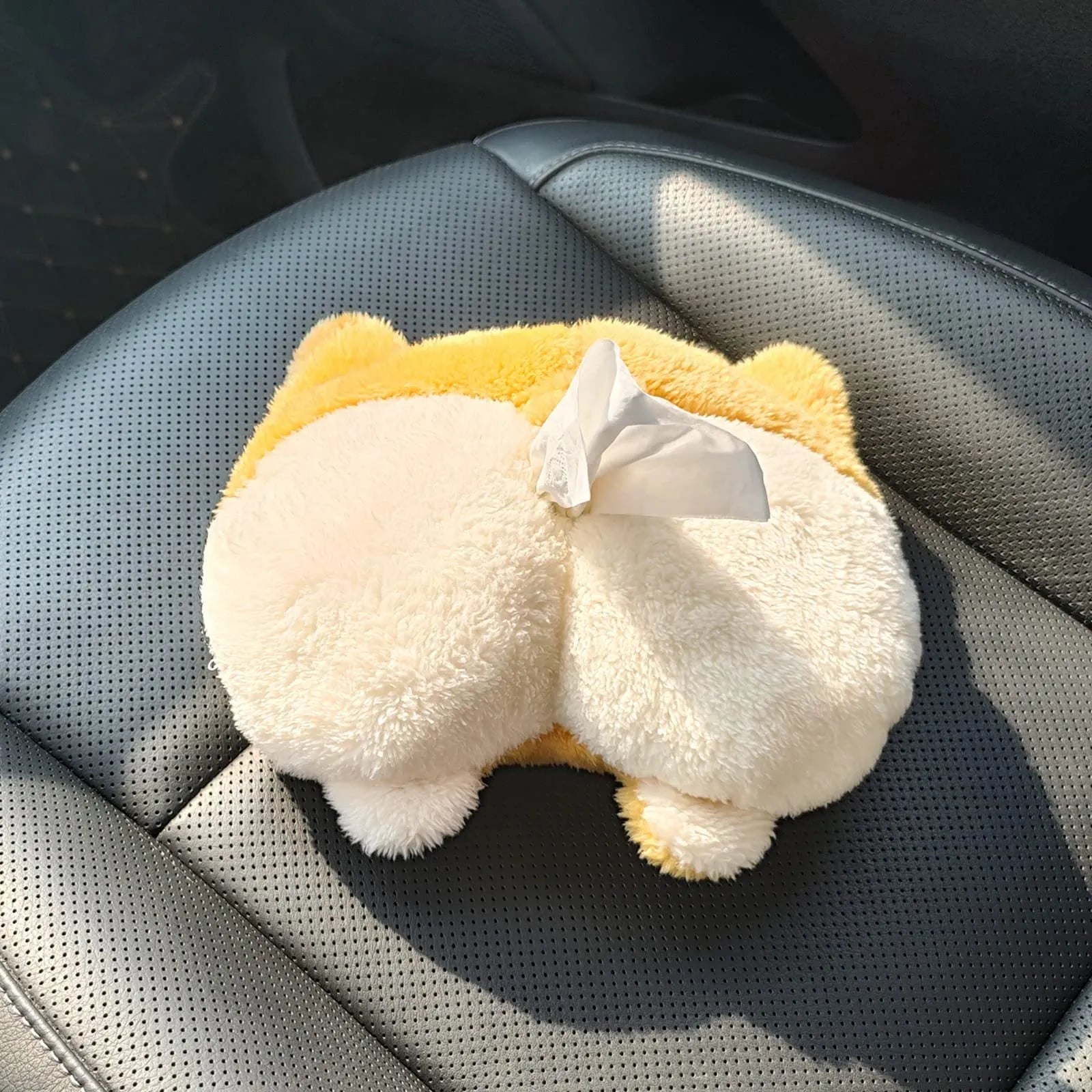 Yellow corgi butt shaped fabric pouch for holding a tissue box, shown with elastic strap for hanging.