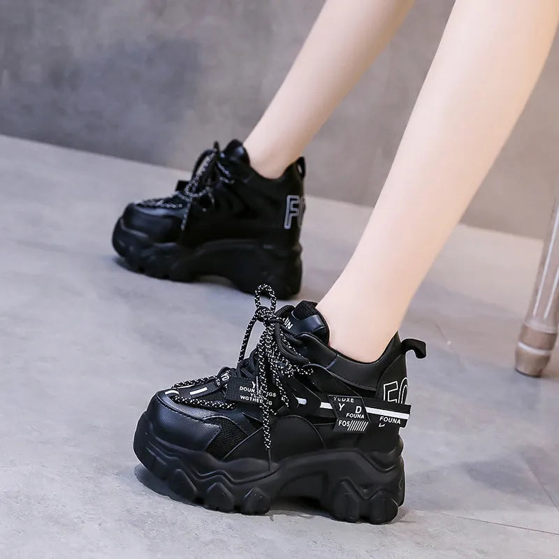 Women's white and black mesh platform sports shoes with cross-strap design and rubber sole