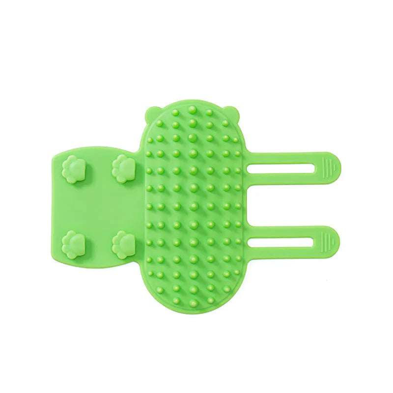 Silicone cat grooming and scratching brush with adjustable strap wrapped around a table leg.