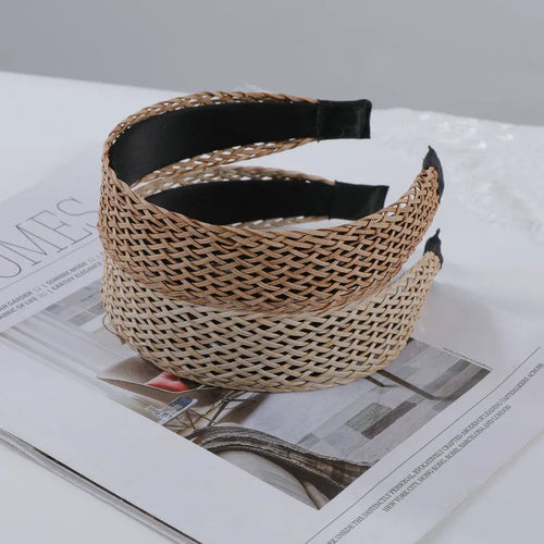 Bamboo woven wide brim hair band in black with bend and hitch details, side view on plain background