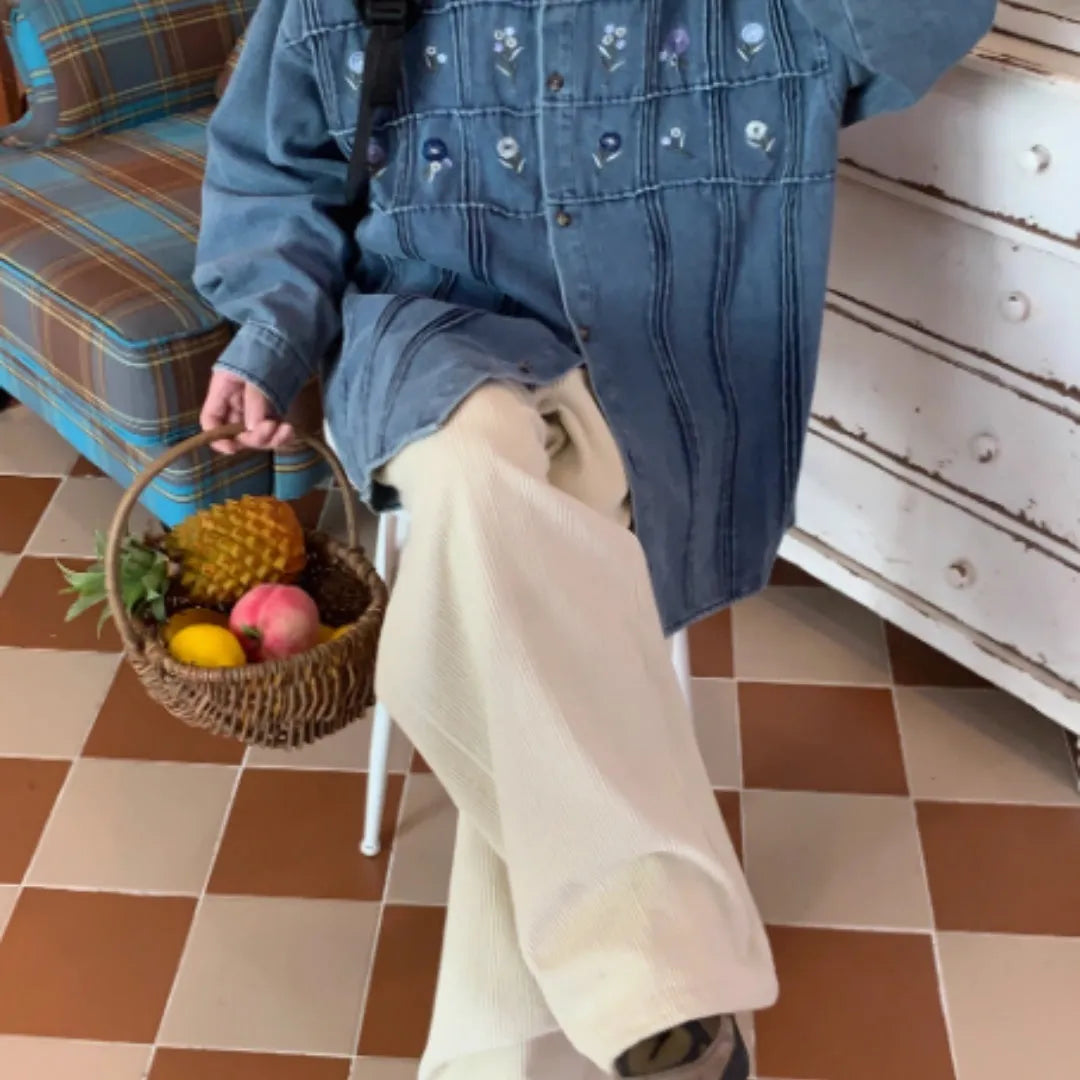 Vintage washed blue denim shirt with small floral print and pleated detail, long sleeves with button front