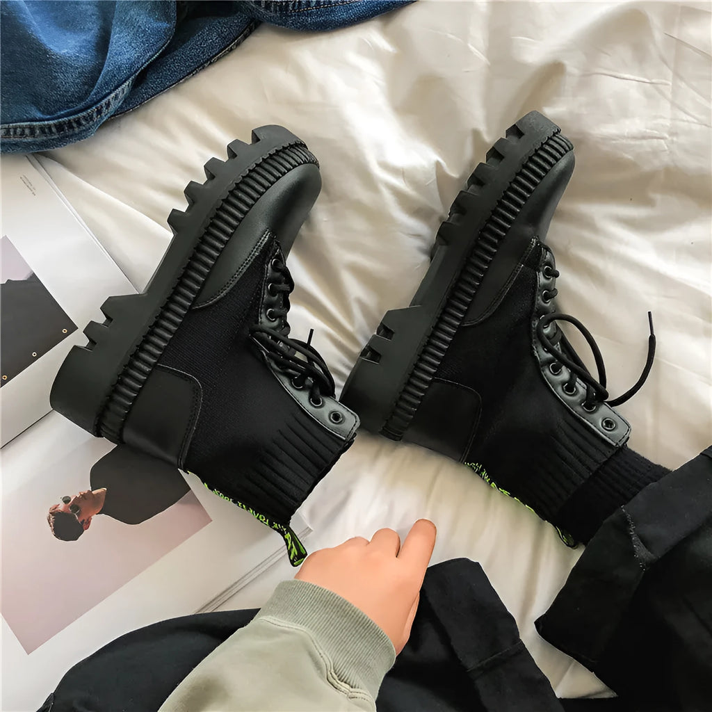 Men's black Doc Martens platform boots with 8-hole high-top design and a side zip fastener.