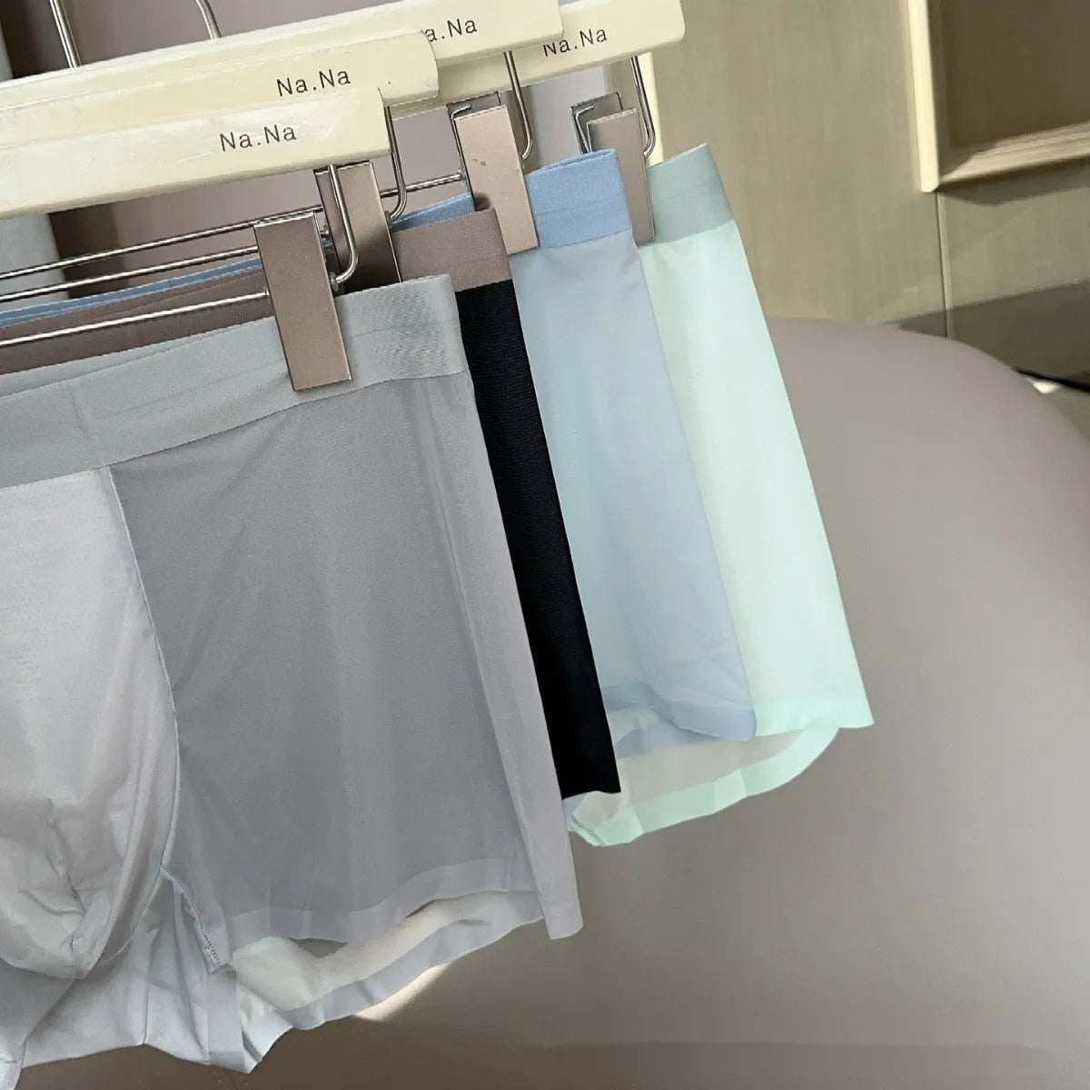 Seamless ultra-thin men's boxers in Ice Silk fabric with a honeycomb crotch, shown in a neutral colour.