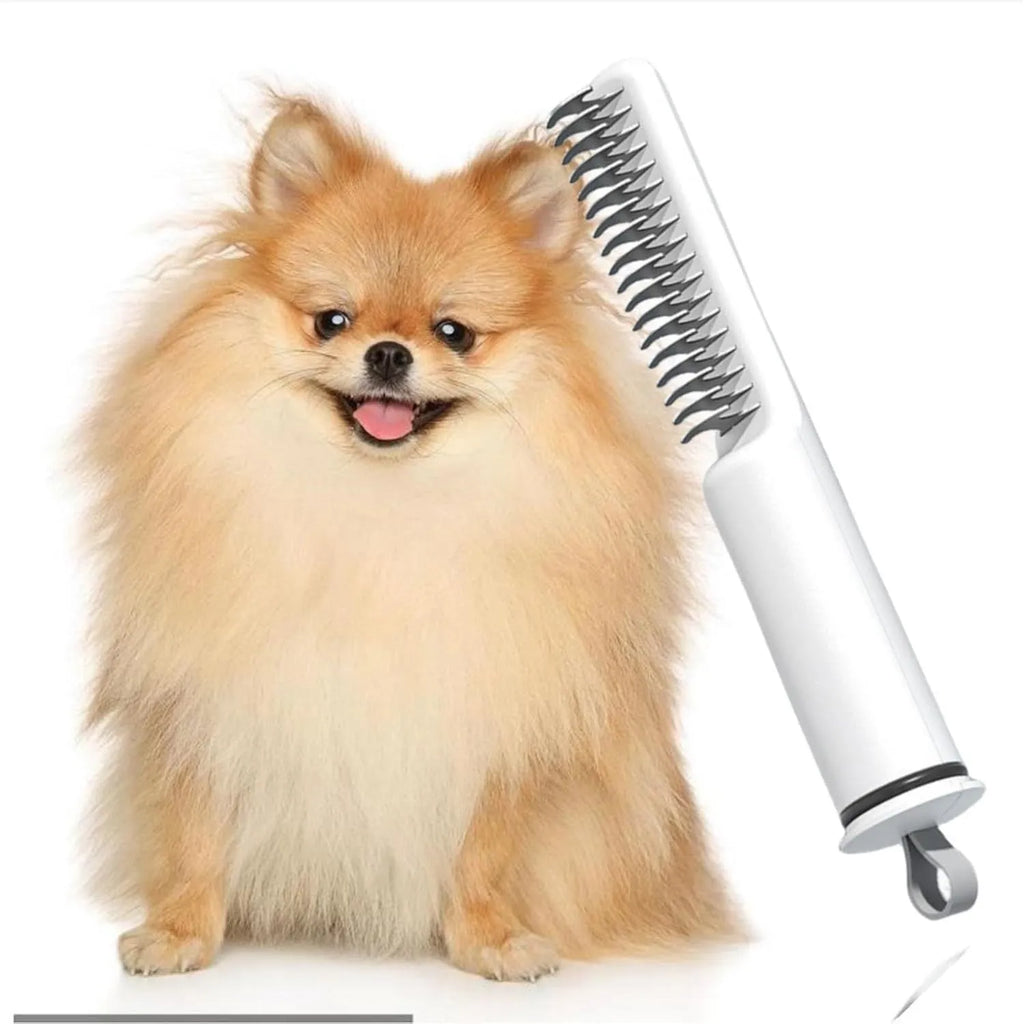 Pink and white stainless steel dematting comb for dogs with ergonomic handle on a plain background.