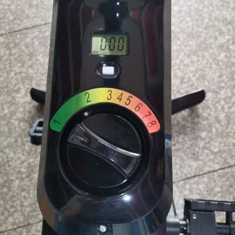 Black upright exercise bike with magnetic resistance and built-in table for home fitness