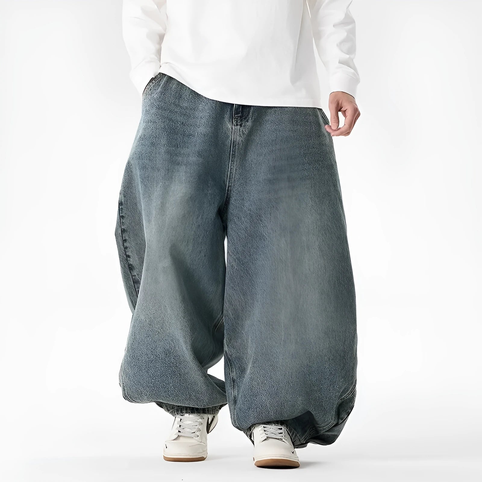 Men's loose-fit straight leg jeans in black denim on a hanger.