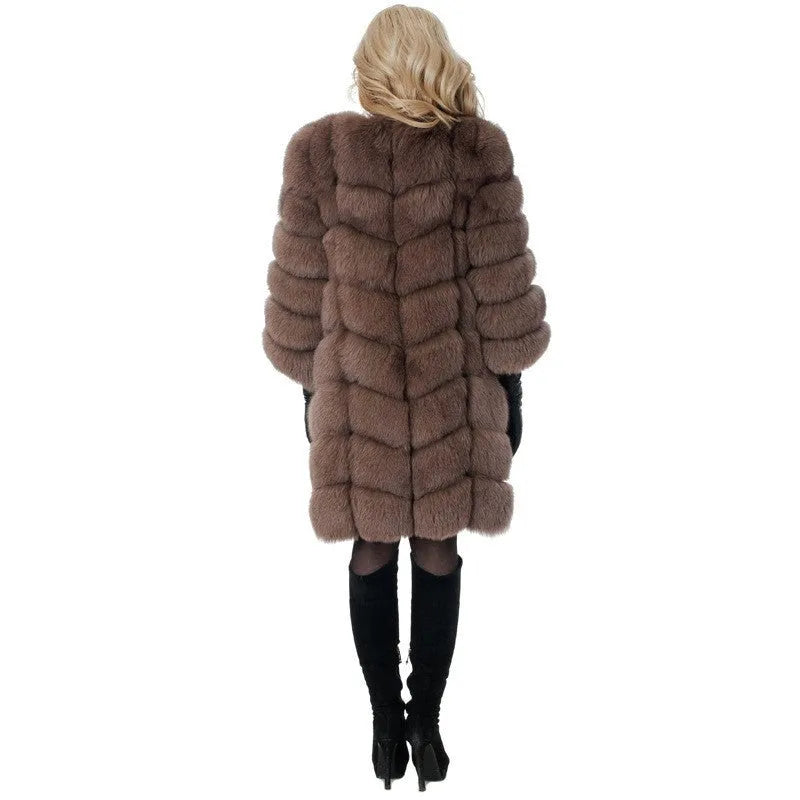 Women's long artificial fur coat in black colour showing regular sleeves and full-length design
