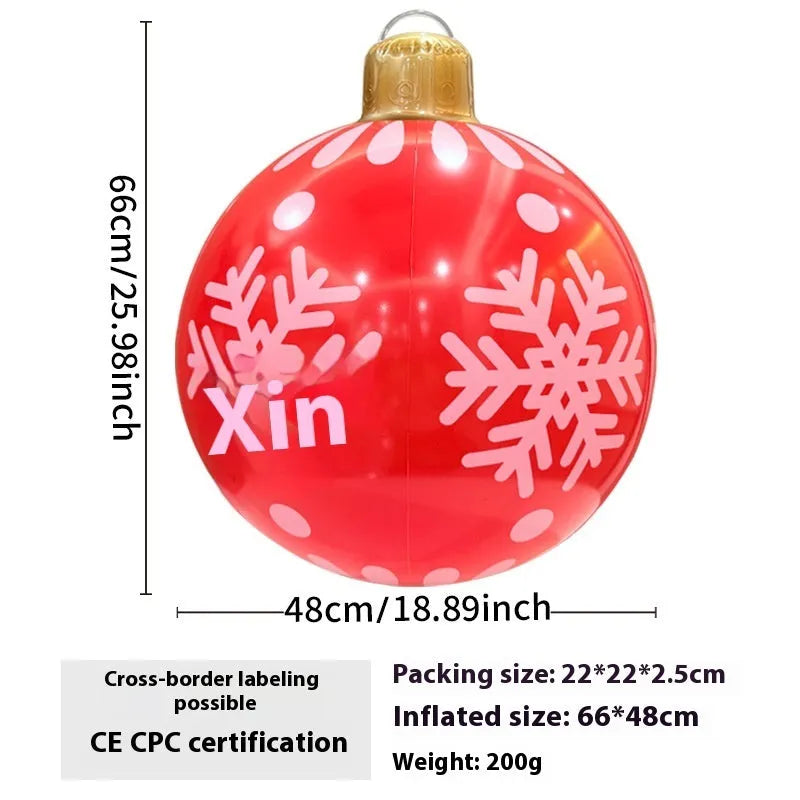 Large red inflatable Christmas ball with flash lights, shown with manual pump, for garden decoration.