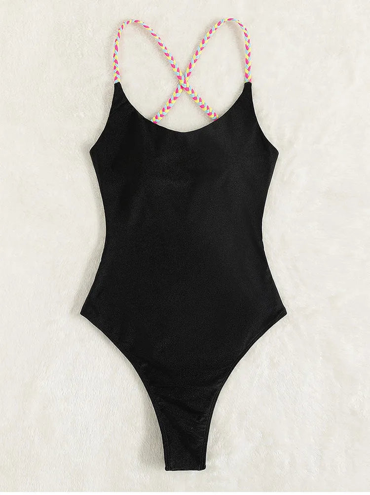 Black backless sleeveless one-piece swimsuit laid flat.