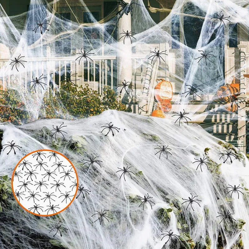 White cotton spider web Halloween decoration with plastic spiders for parties and home displays