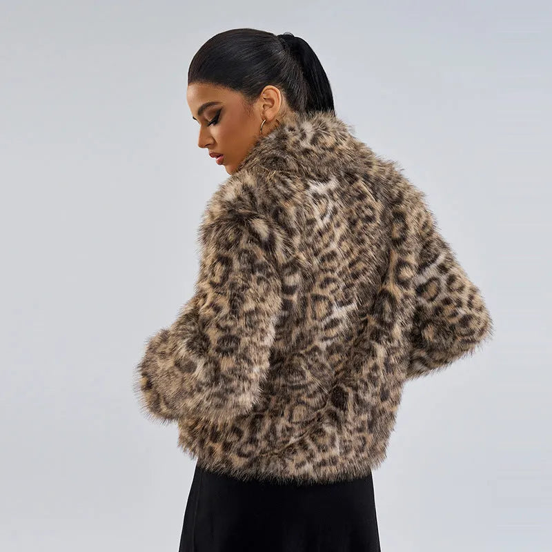 Women's leopard print street fashion coat with regular sleeves on a hanger.