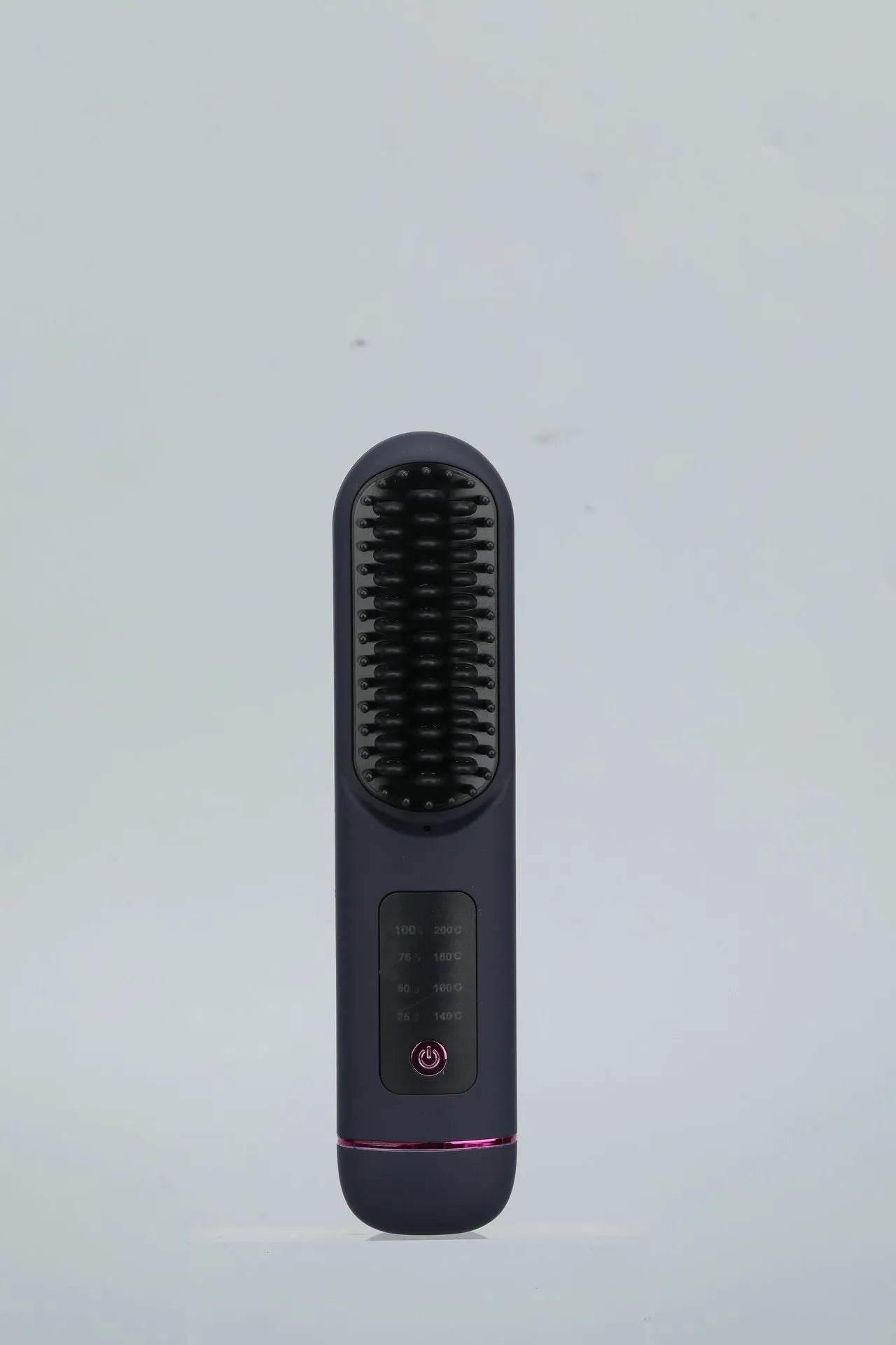 White portable negative ion hair comb with rechargeable battery on a plain background.