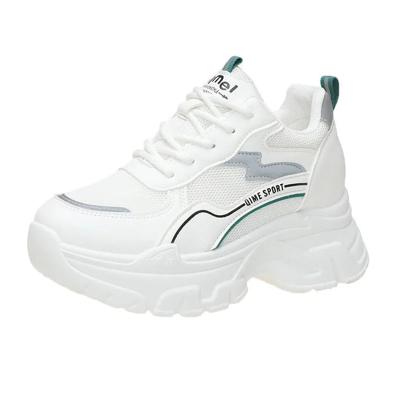 Women's white low-top dad shoes with cross straps and lace-up front