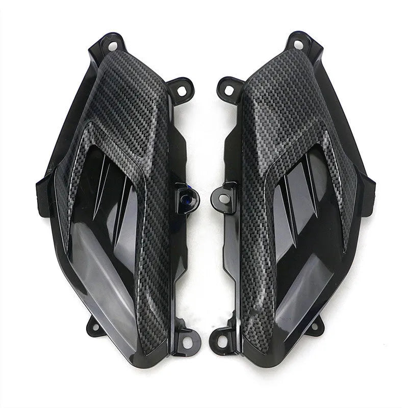 Pair of Yamaha NMAX carbon fibre LED side lamps showing blue and red light options