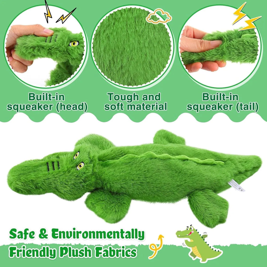 Green crocodile-shaped plush dog toy with squeaker in head and crinkle paper tail