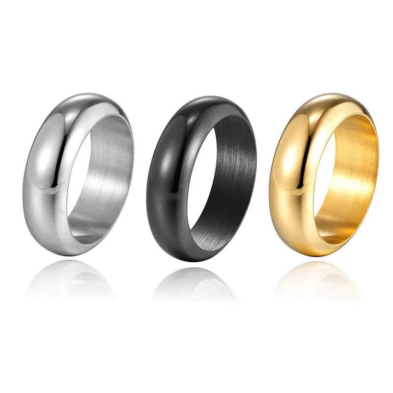 Glossy electroplated titanium steel ring shown in black, gold, and steel colour on a neutral background.