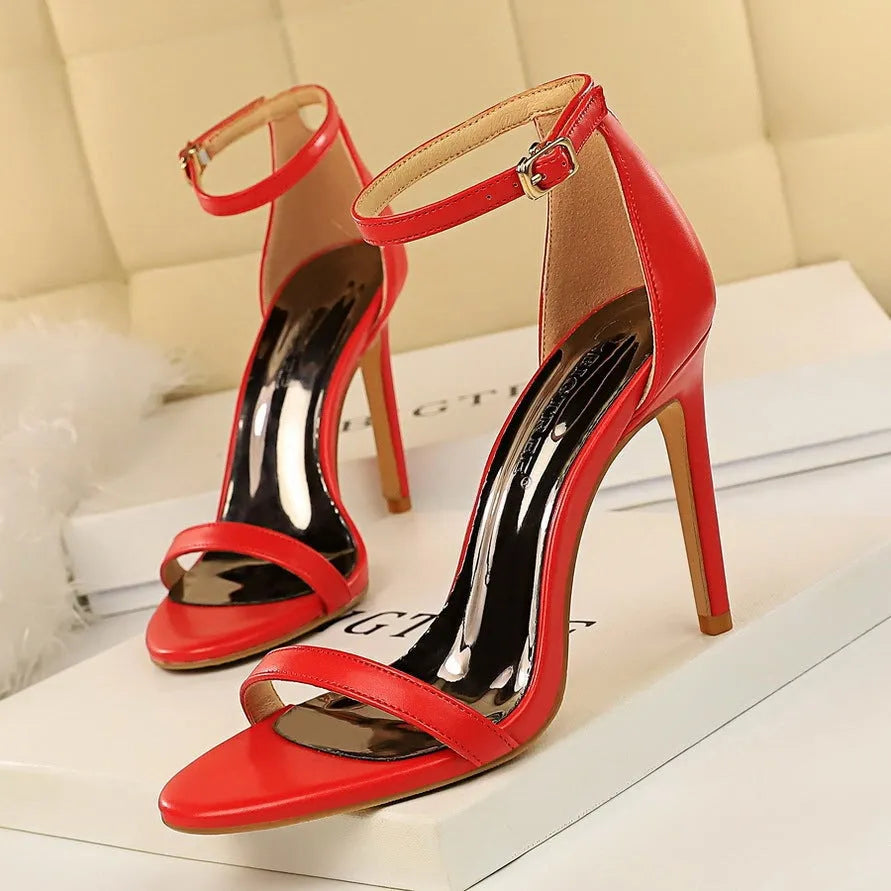 Women's open toe high heels with an ankle strap buckle in six colour options.
