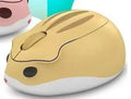 Hamster Wireless Mute Mouse in grey, pink, or yellow colour on a desk.