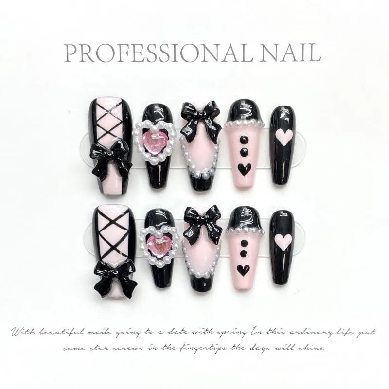 Black pink heart shape hand-painted false nails with bow designs in plastic armour suit