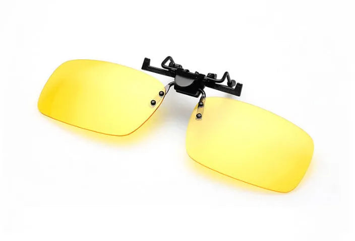 A clip-on sunglasses accessory with PC lenses shown in dark green, grey, and night vision tints, designed to fit over prescription glasses.