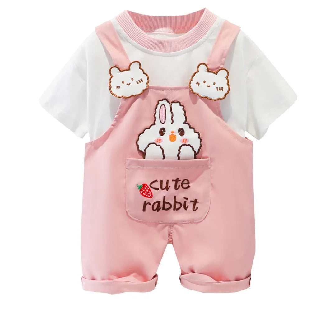 Yellow cartoon short-sleeved overalls for a baby on a hanger, showing the adjustable straps.