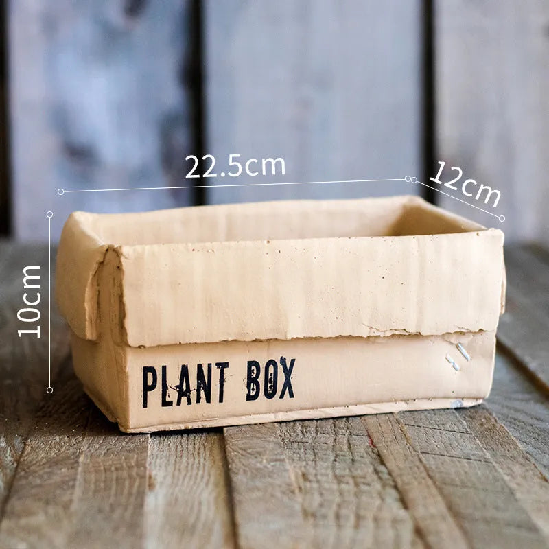 Cement flowerpot with bottom drainage holes and paper box texture in Nordic style design