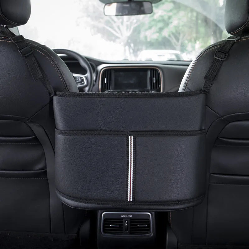 Black leather car seat hanging storage bag with tissue box between car armrests