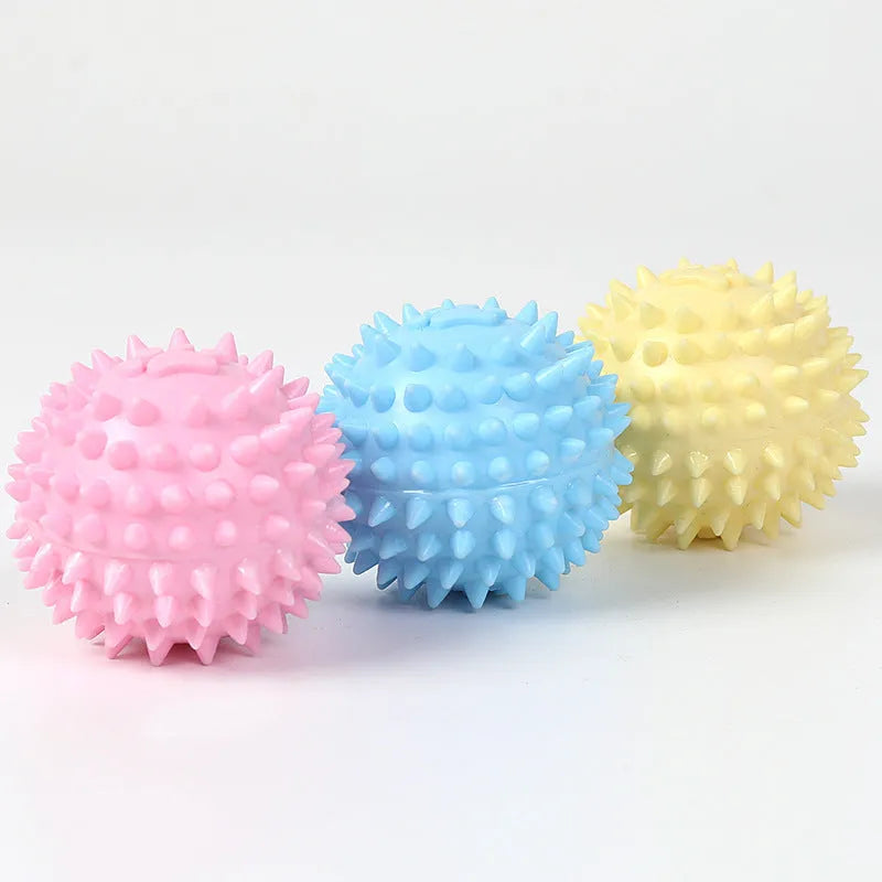 Blue TPR dog chew ball with footprint texture, 6cm diameter, for tooth cleaning and play.